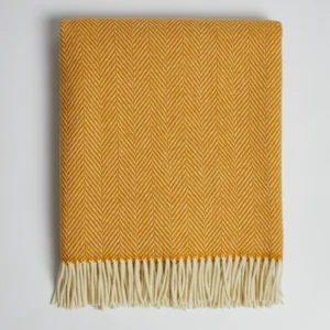 Hochwertige Foxford Decke Innisfree in warmen goldenen Farbtönen